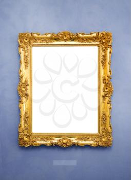 Ornate picture frame on a blue wall