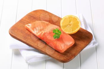 Fresh salmon fillet on a cutting board