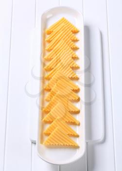 Hard cheese cut into triangles 