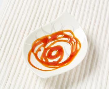 Caramel drizzle sauce on plate