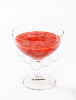 Chilled strawberry puree in stemmed glass