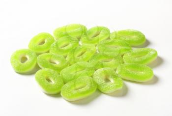 Ring-shaped apple gummies coated in sugar