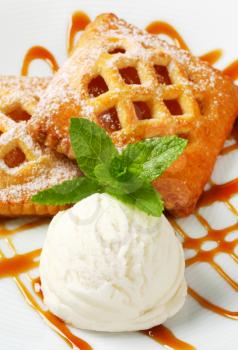 Little apricot pies with ice cream and drizzle sauce