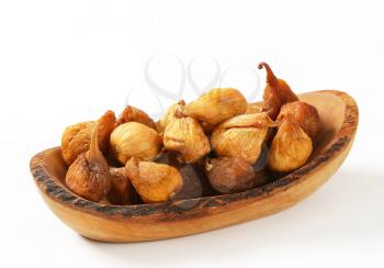 Dried figs in olive wood bowl