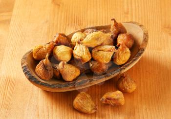 Dried figs in olive wood bowl