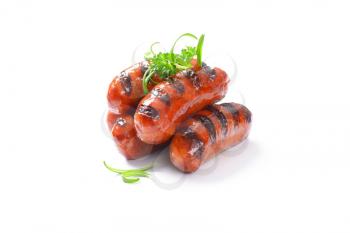grilled sausages on white background