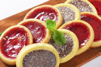 Mini tarts with jam and chocolate coconut filling