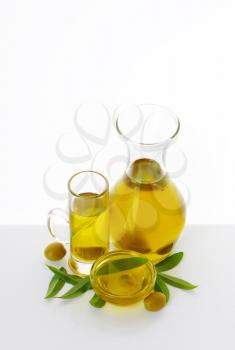Olive oil in clear glass serving vessels