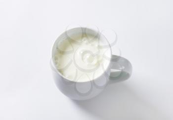 mug of milk kefir on white background