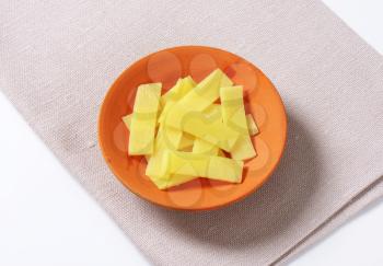 bowl of sliced bamboo shoots on place mat