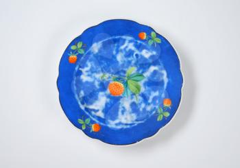 blue strawberry design plate with scalloped edge