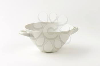 Conical white soup bowl with two handles