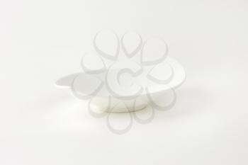empty curved white bowl on white background