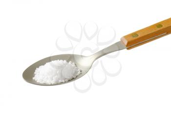 teaspoon of coarse grained salt isolated on white
