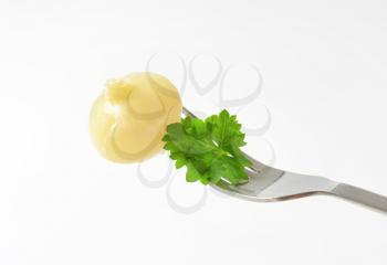 Small pickled onion on a fork