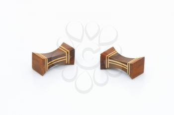 two wooden decorative chopstick rests