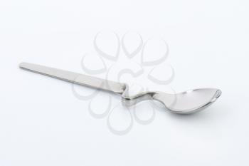 metal spoon with long bent handle