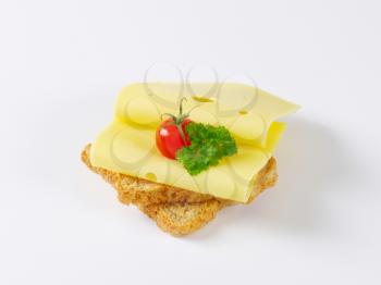 slices of whole grain bread with emmenthaler cheese