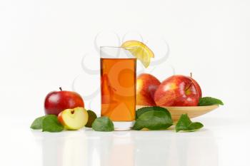 fresh red apples and glass of apple juice