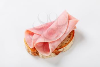 Slice of continental bread with ham