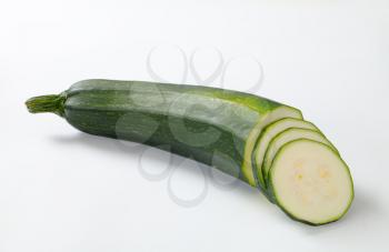 sliced fresh zucchini on a white background