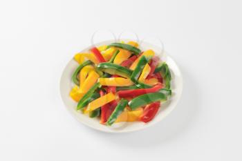 Plate of three color bell pepper strips