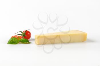 wedge of parmesan cheese and cherry tomatoes