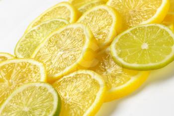 heap of fresh lemon and lime slices
