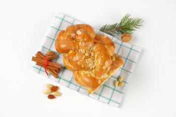 Christmas sweet braided bread with almonds and raisins