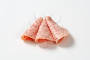 thin slices of cooked deli meat sausage