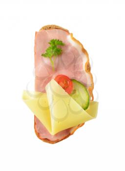 slice of bread with ham and cheese