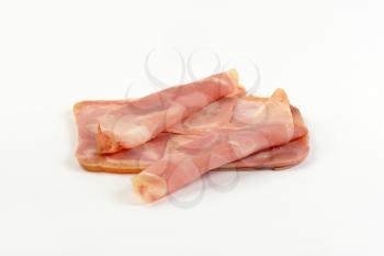 slices of pork ham on white background