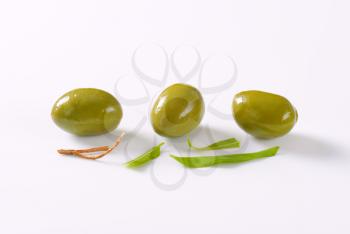 fresh green olives on white background