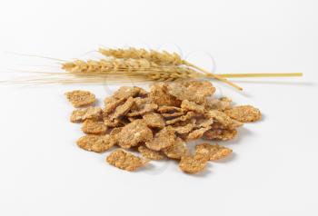 pile of breakfast cereal on white background