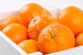 box of fresh oranges - close up