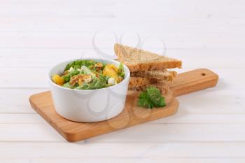 Chinese cabbage salad with orange, walnuts and blue cheese served with bread