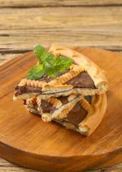 Slices of chocolate crostata on cutting board