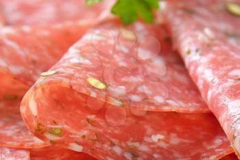 detail of thin slices of Green pepper salami