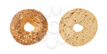 halved bagel with seeds on white background