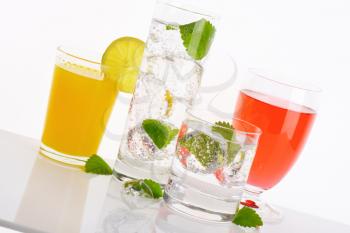 variety of summer cold drinks on white background - close up