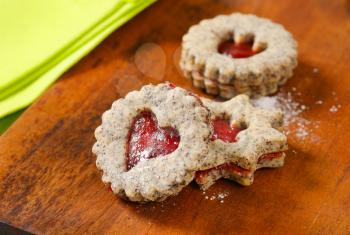shortbread cookies with jam filling
 on wooden background