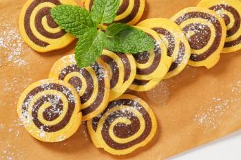 sweet chocolate rolls on baking paper