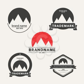 Vector set of emblems associated with mountains.