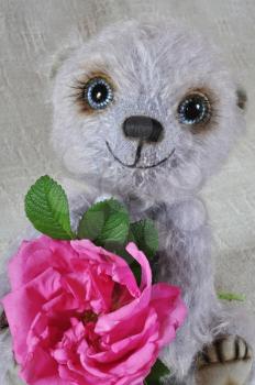 Handmade, the sewed toy: teddy-bear Chupa with a dogrose flower
