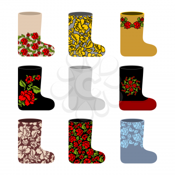 Set national Russian winter footwear. Traditional warm boots in Russia. Ornament of colors on shoe. Khokhloma painting on clothing and accessories.