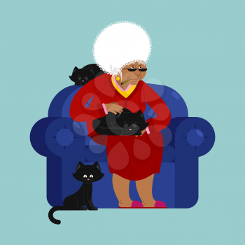 African American Grandmother and cat sitting on chair. granny cat lady. grandma and pet. old woman and animal. gammer and Beast
