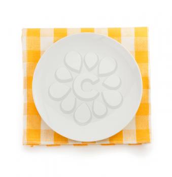 plate at napkin on white background