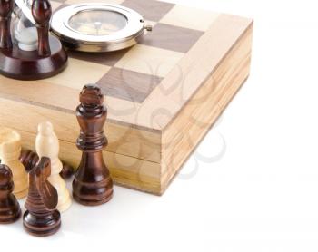 chess piece, compass and sand glass on board isolated at white background