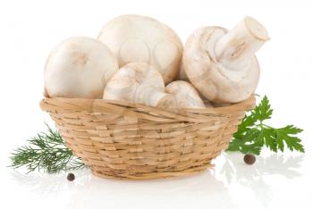 mushrooms and wicker basket with spices isolated on white background