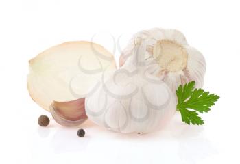 garlics and onion spices with parsley isolated on white background